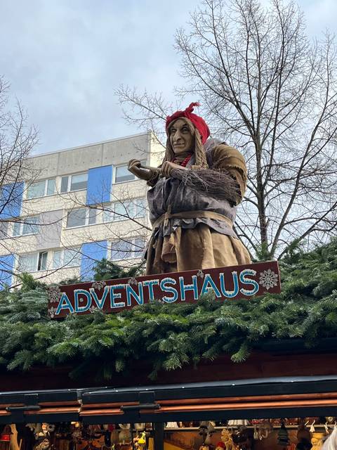       Advent Haus with a festive figure and decorations
  