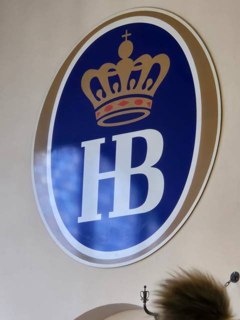 Couple standing next to a medieval castle.