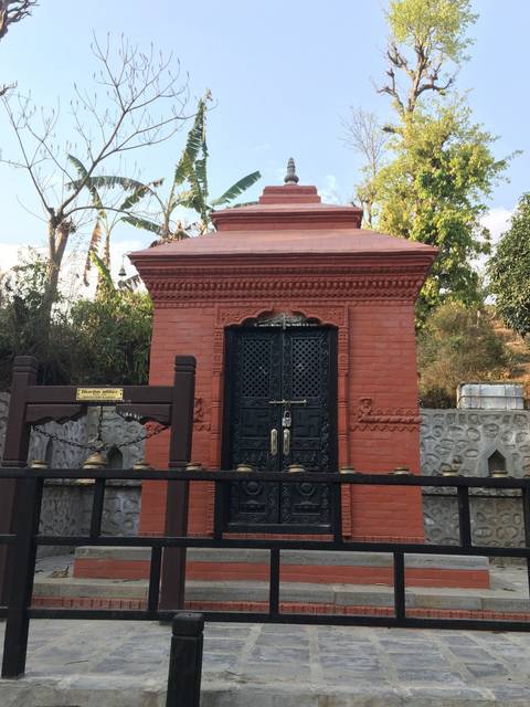 Traditional red brick structure with intricate designs.