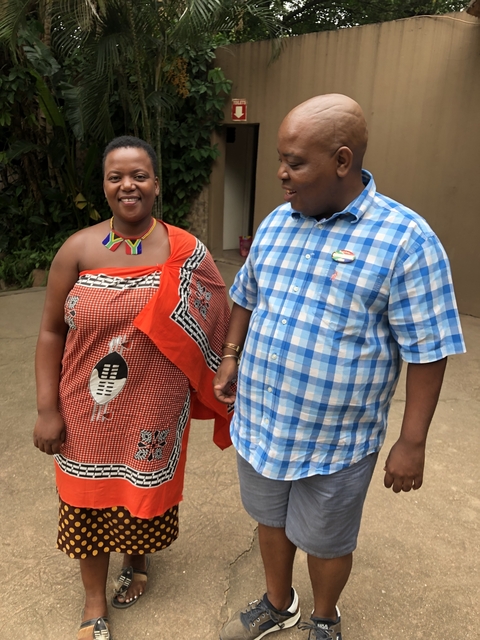 Two people in traditional clothing standing together.