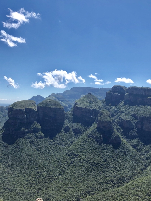      Majestic mountain landscape with clear blue sky.
  