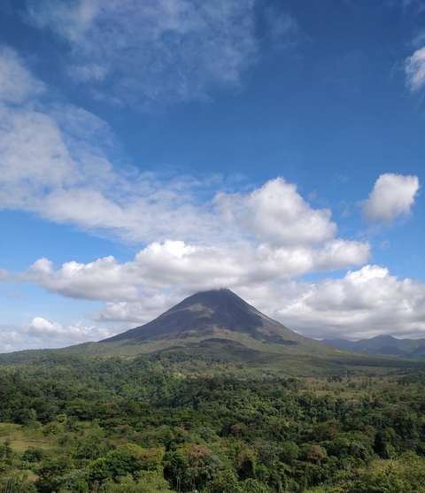 Arenal Volcano with clouds around the summit.