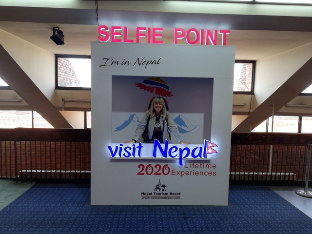       Visitor inside a selfie booth promoting Nepal 2020.
  
