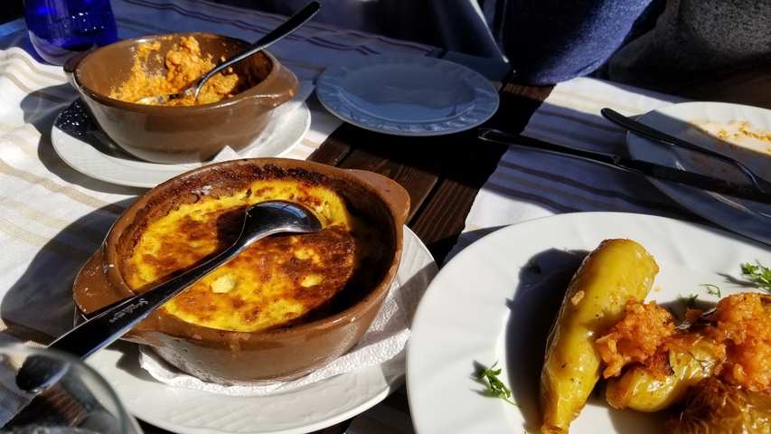       Traditional Albanian dishes served in earthenware bowls.
  
