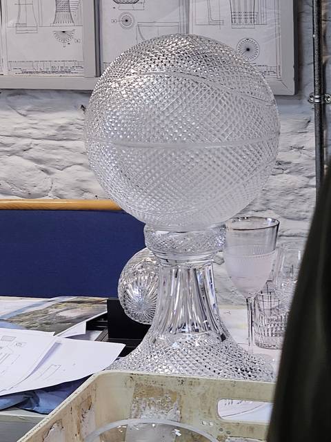       Glass objects on display in a workshop.
  