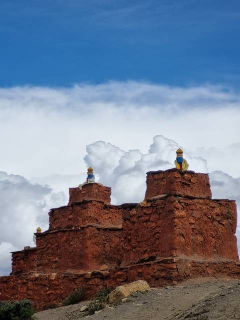       Stacked rock formations with a vivid blue sky.
  