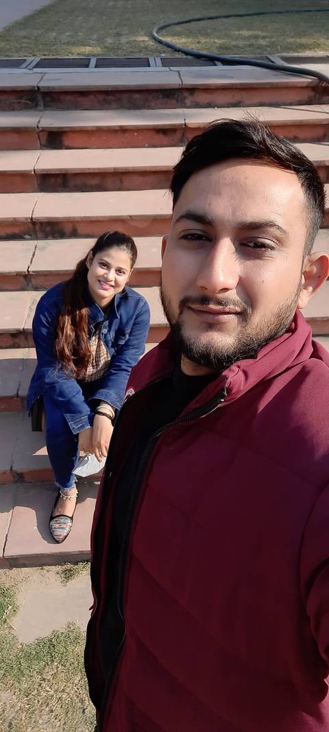       Couple taking a selfie on steps
  