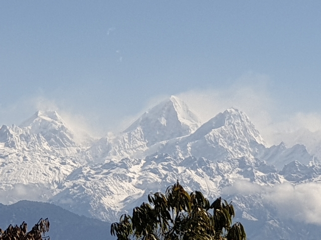       Snow-capped mountains against a clear sky.
  