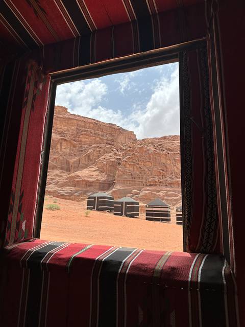 View from inside a tent with rock formations outside.