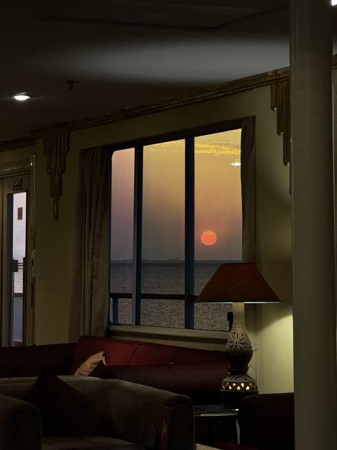 A sunset viewed from a window.
