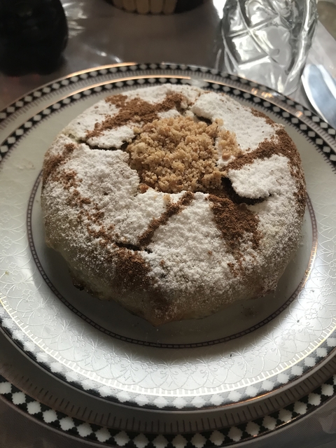       Traditional Moroccan dish covered in powdered sugar and cinnamon.
  