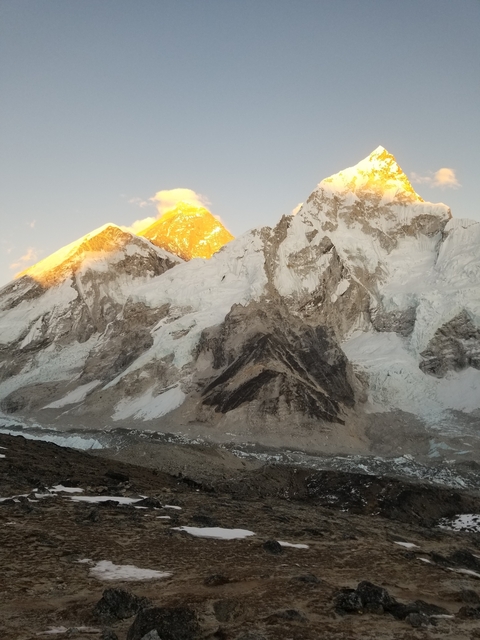 Majestic view of snow-capped mountains at sunrise.