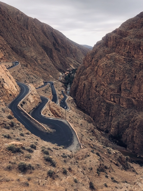Winding road through steep rocky cliffs