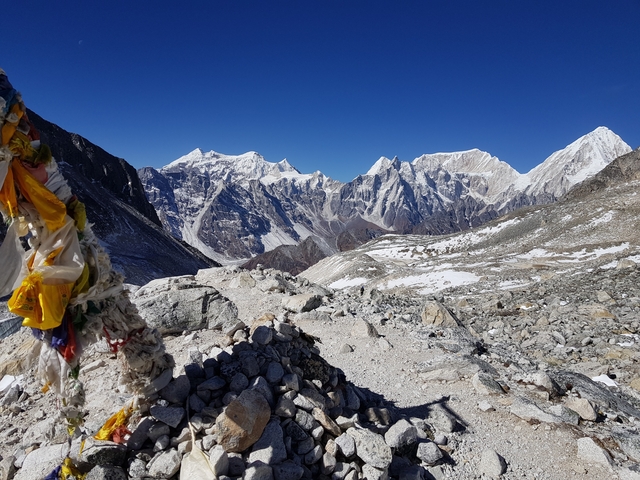       Prayer flags against a backdrop of mountains.
  