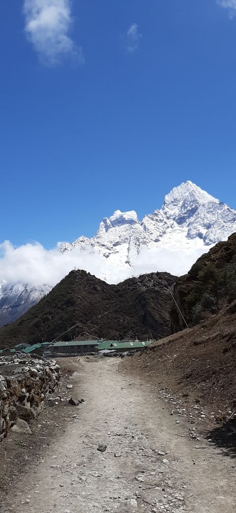 Snow-capped peaks with clouds.