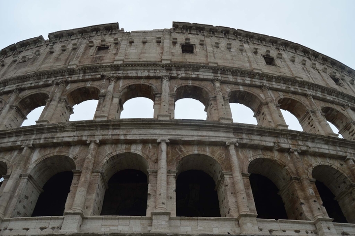 Close-up of the Colosseum with blue sky above