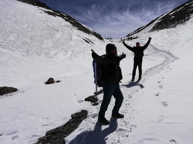       Hikers posing in a snowy setting
  