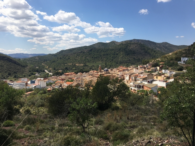 Aerial view of a small town nestled in the hills.