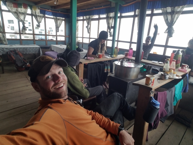 Group of people relaxing inside a cozy lodge.