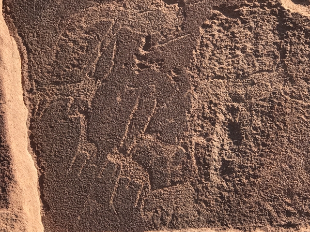       Rock carvings on a rough surface.
  