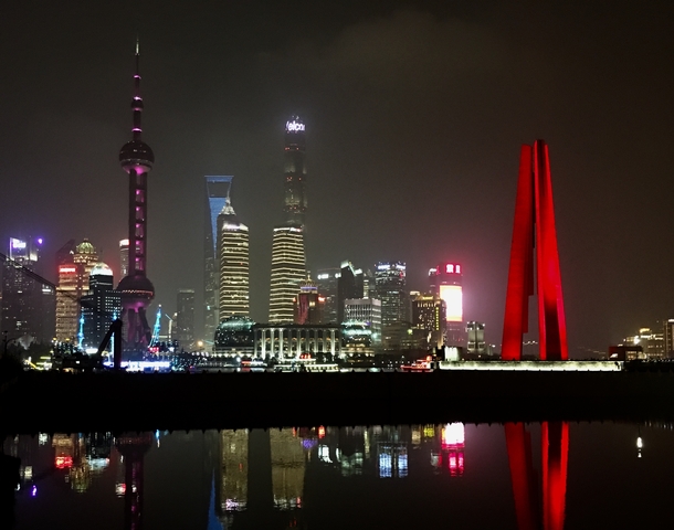 Shanghai's skyline lit up at night.