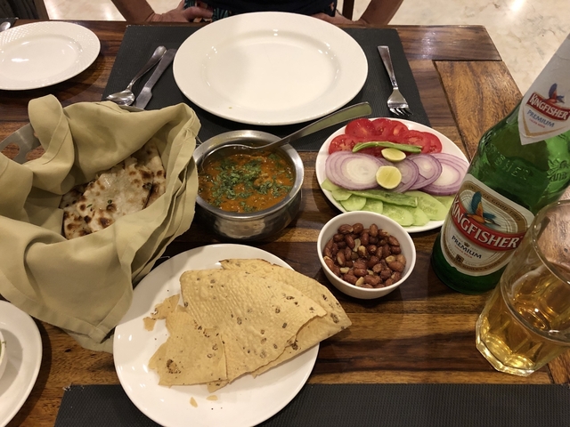       Traditional Indian meal setup with various dishes.
  