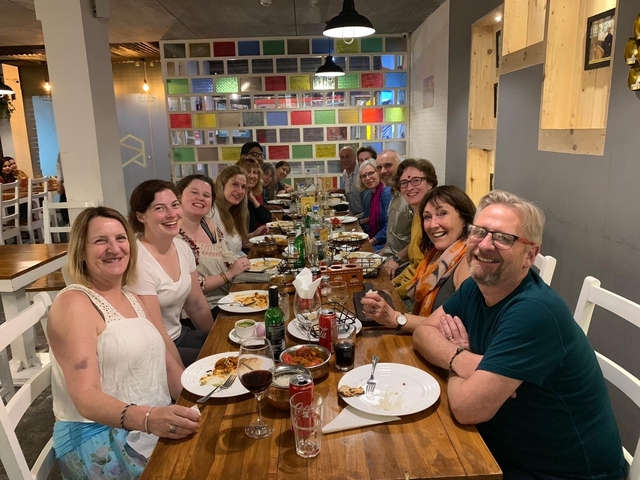 Group of people dining together in a modern restaurant.