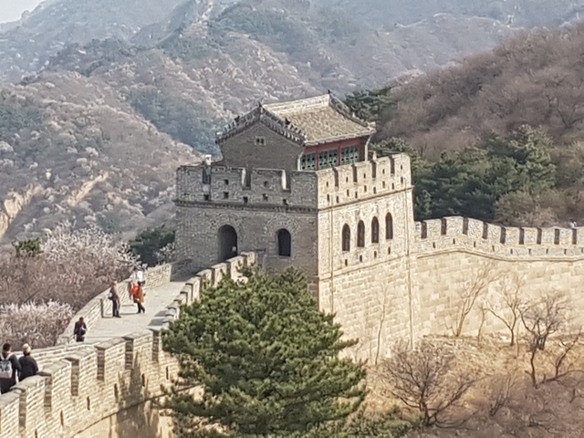 View of the Great Wall of China stretching over mountain ridges.