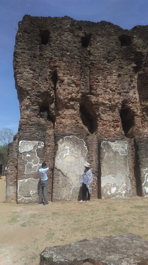 Ancient ruins with people exploring.
