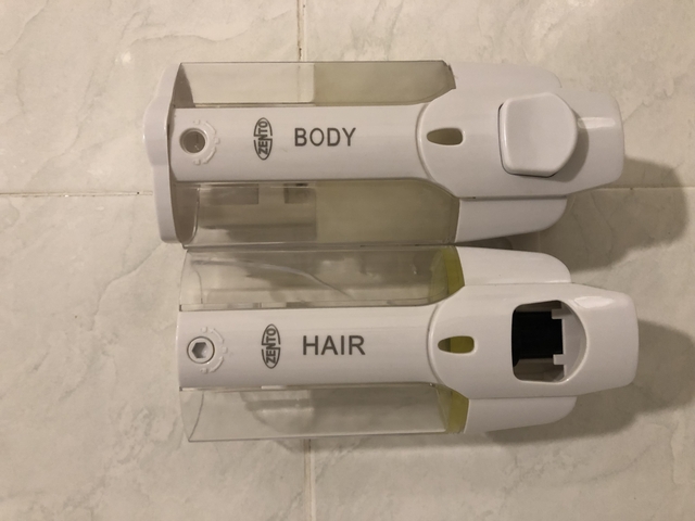       Wall-mounted body and hair liquid dispensers.
  