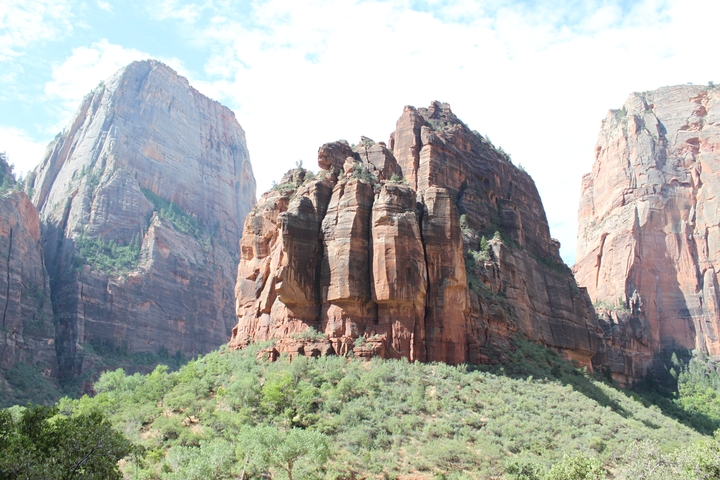 Imposing rocky landscape with lush greenery.