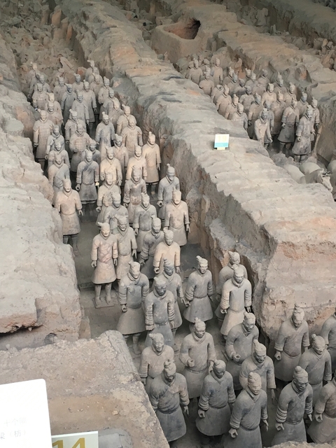       View of Terracotta Warriors in their excavation pit.
  