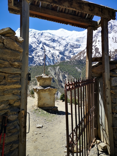 Mountain view framed by gate and ornamental structure