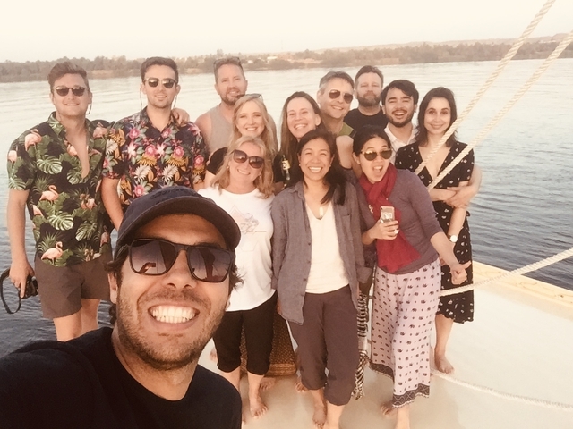 Group of people on a boat enjoying a sunny day.