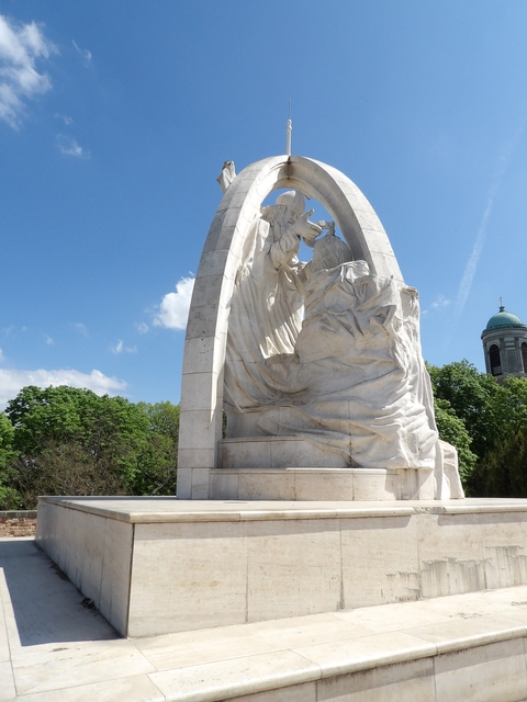 A large marble statue depicting an angel and a human figure.