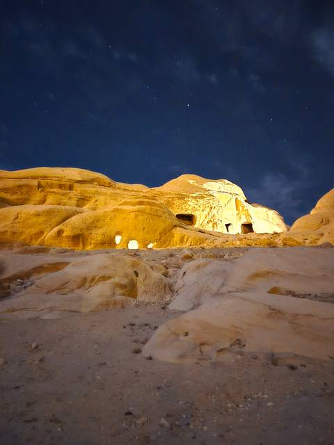 Rock formation lit at night, rotated view