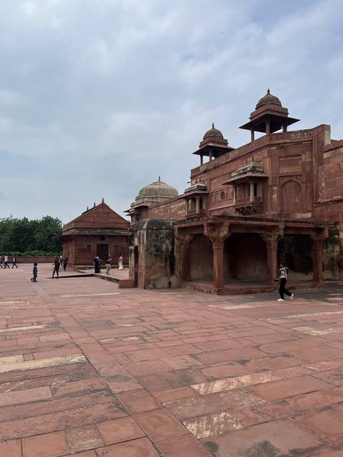 Historical building with red sandstone architecture.