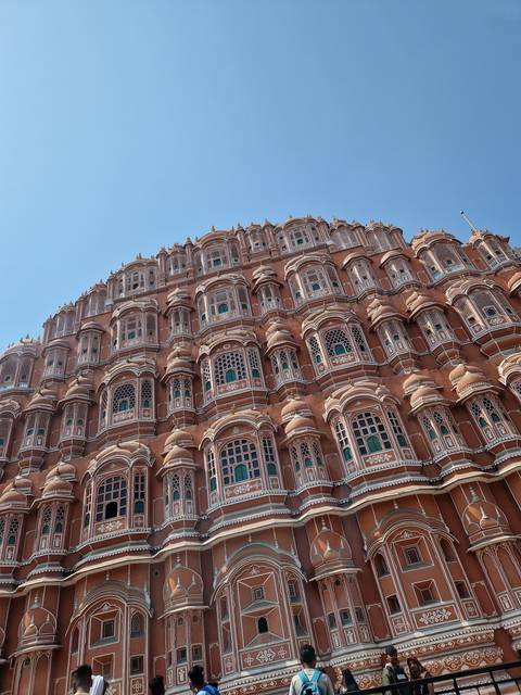       Front view of an architectural marvel with intricate windows.
  