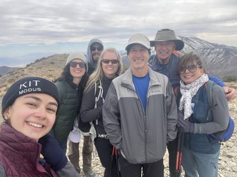       Group of people posing outdoors.
  