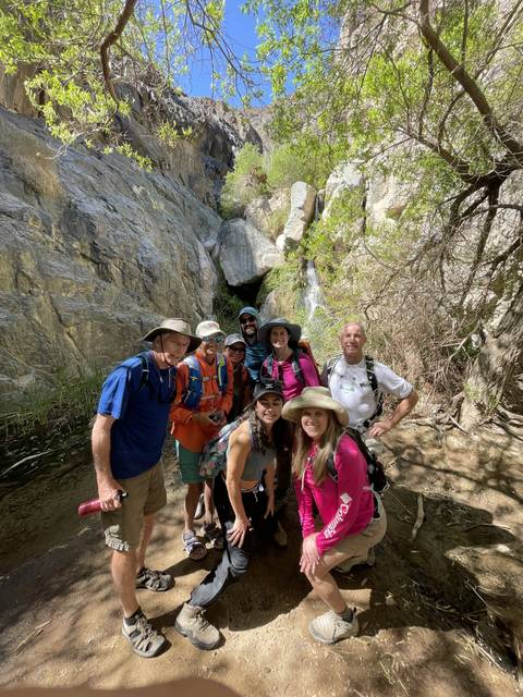       A group of hikers in a rocky area.
  