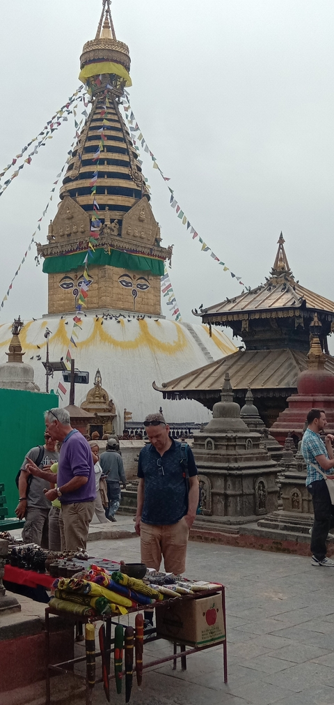       Large stupa with eyes, surrounded by smaller temple structures.
  