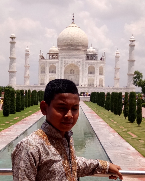 Boy with a famous monument in the background.