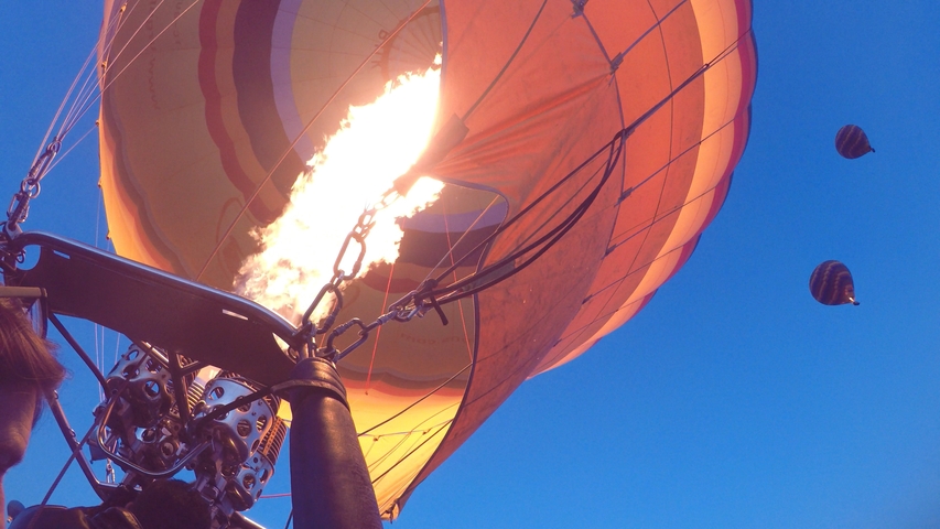       Close-up view of a hot air balloon inflating.
  