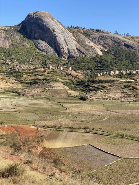 Terraced fields and rocky hill.