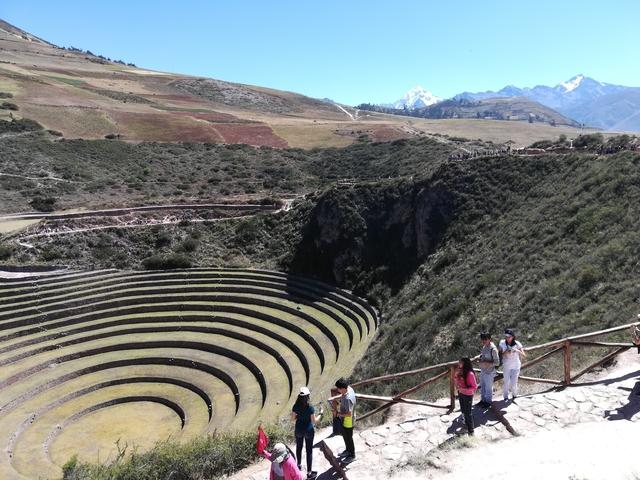Circular terraces at Moray with tourists walking on the paths.