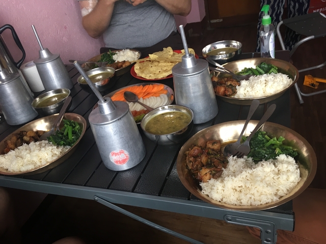       Traditional meal spread on a table with several dishes.
  