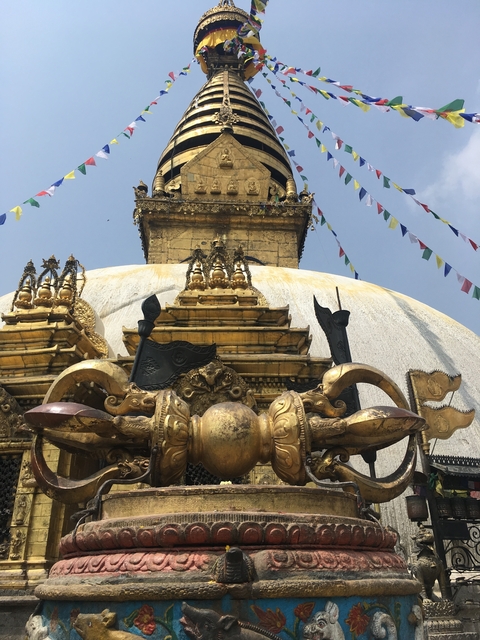       Close-up view of a golden stupa with intricate details.
  