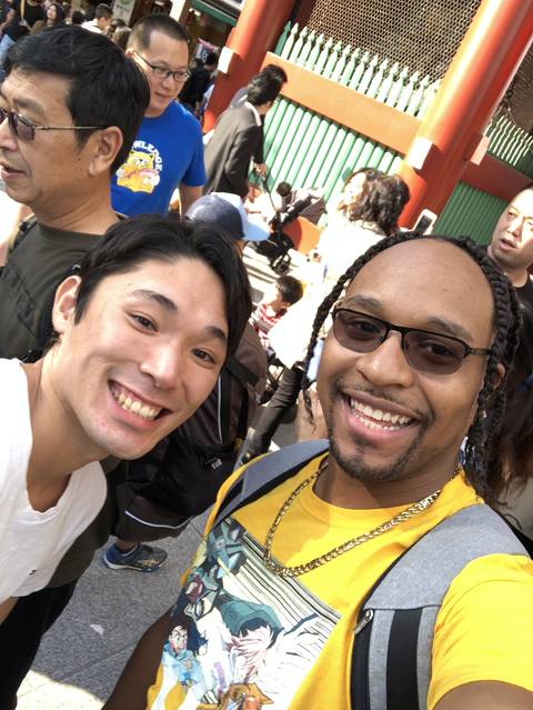 Two people smiling taking a selfie.