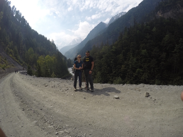       Couple posing on a mountain trail
  