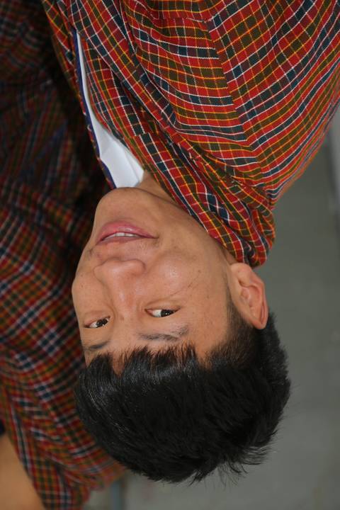       Portrait of a person in traditional clothing.
  